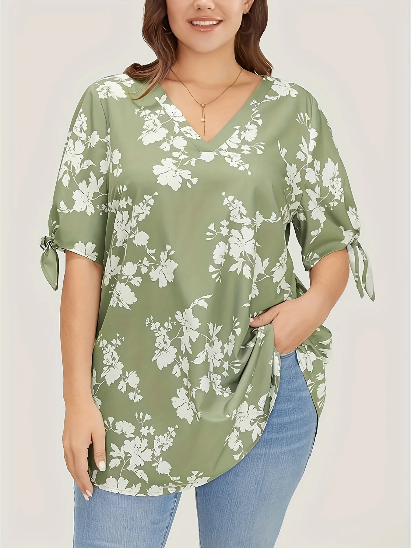 Plus size spring and summer light printed knotted V-neck shirt women's style loose version type office elegant temperament wear