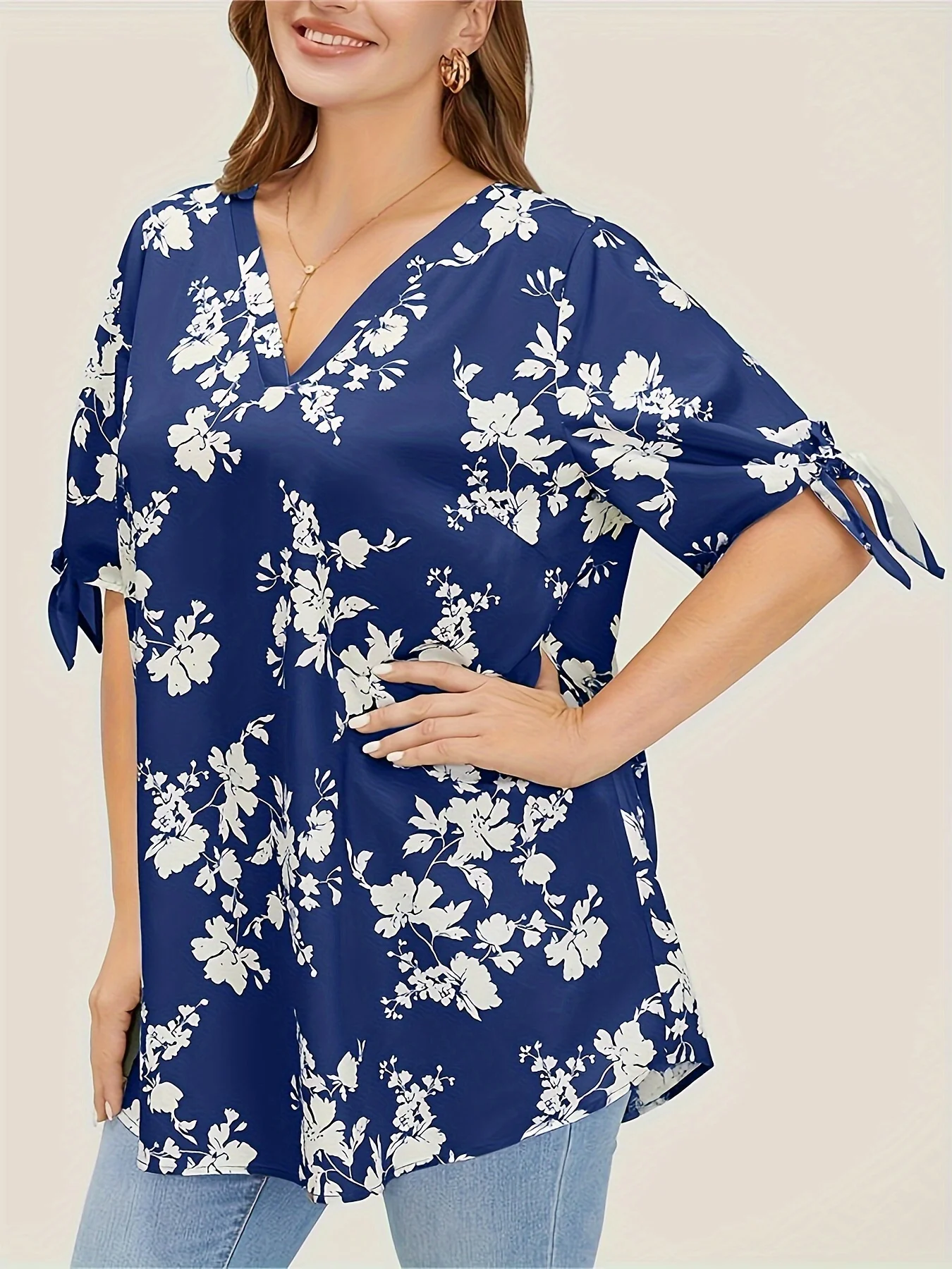 Plus size spring and summer light printed knotted V-neck shirt women's style loose version type office elegant temperament wear