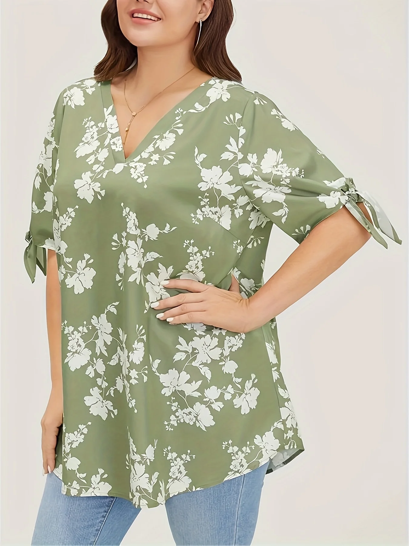 Plus size spring and summer light printed knotted V-neck shirt women's style loose version type office elegant temperament wear